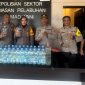 Polsek Pelabuhan Ahmad Yani, amankan puluhan Botol Miras Ilegal.(foto/humas)