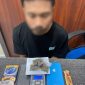 Terduga pelaku ketika diamankan anggota Polres Ternate.(foto/humas)